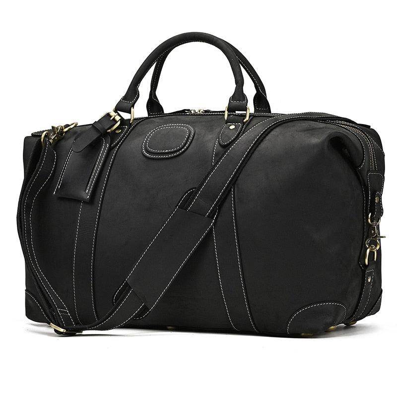 Stylish black vacation style leather bag with sturdy handles and detachable shoulder strap