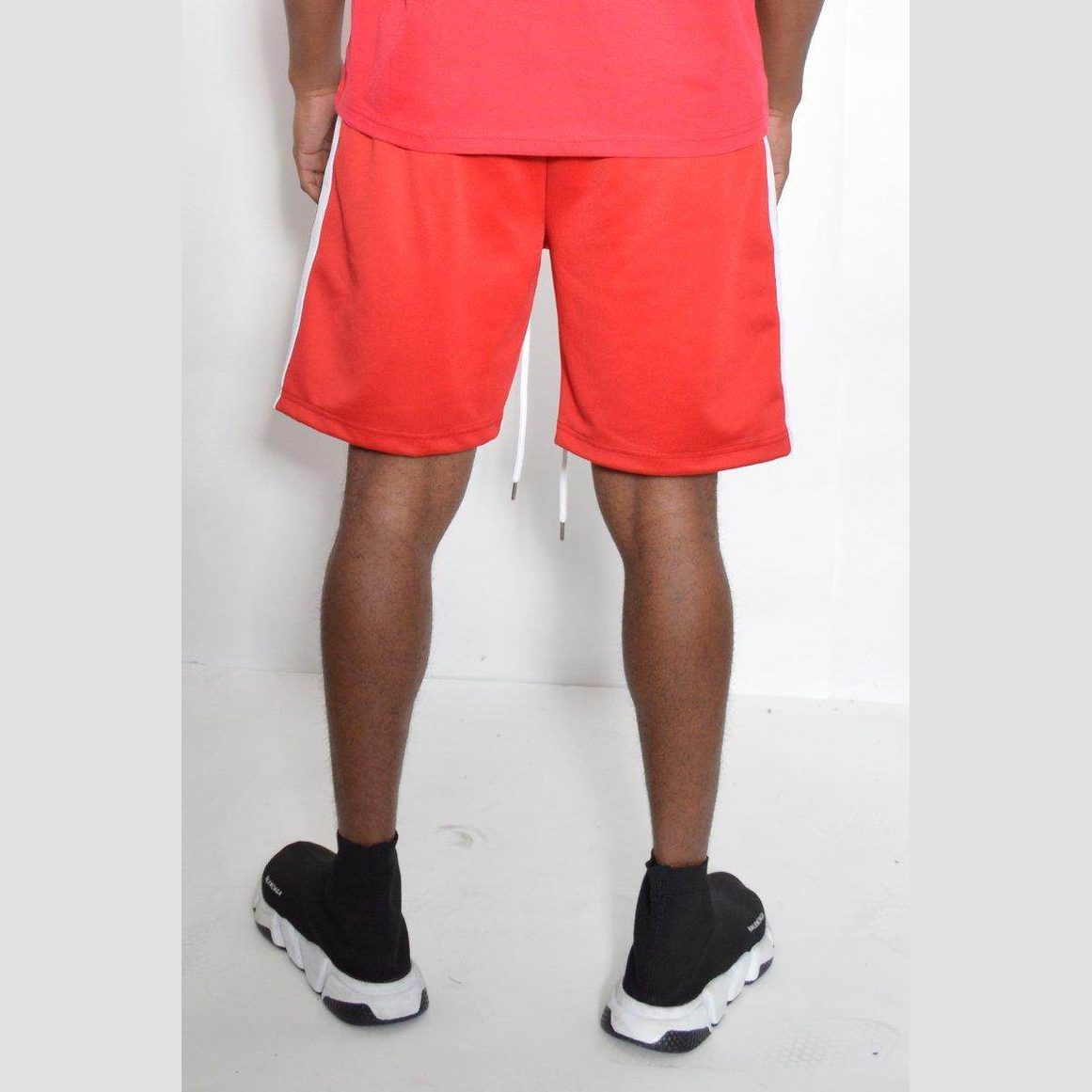 Men's red shorts with white side stripes for a vacation style mens shorts look