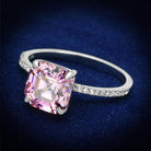 Elegant vacation style silver rings for women with a large pink gemstone and sparkling accents