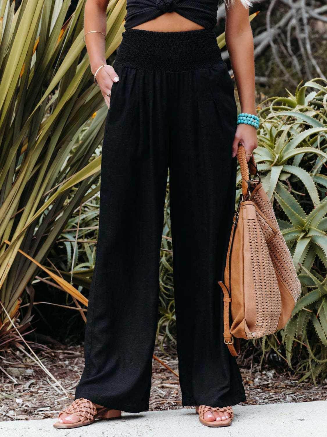 Trendsi women's vacation style wide leg trousers in black with smocked waist and pockets