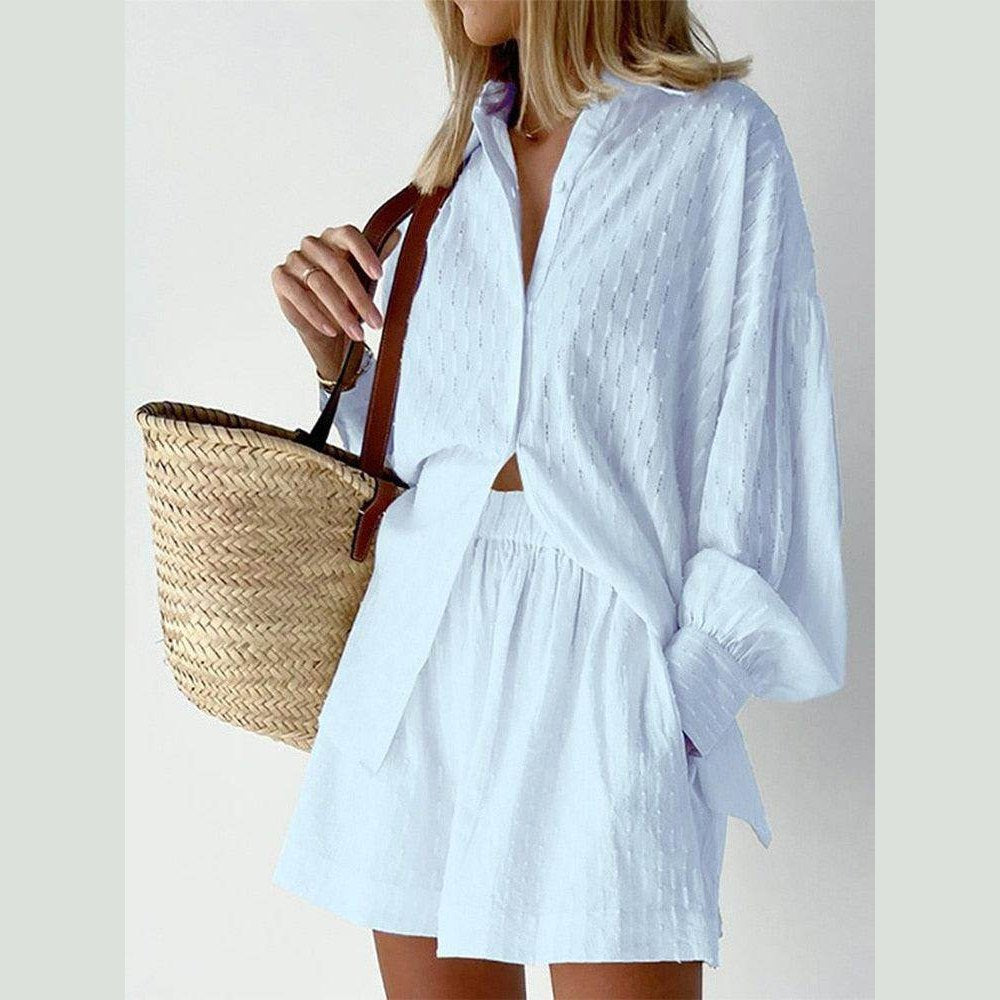 Light blue women's lantern sleeve shirt and shorts set styled with a straw bag, perfect for summer outings