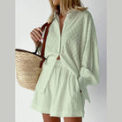 Light green women's outfit featuring a lantern sleeve shirt and shorts, perfect for summer styles