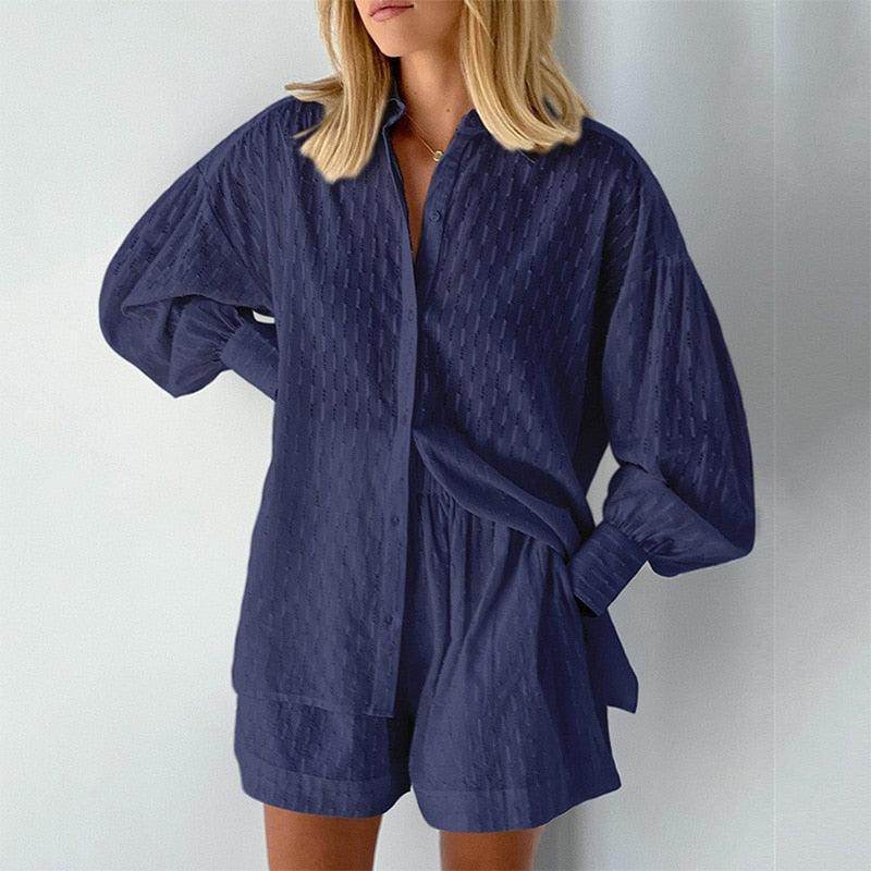 Navy women's outfit featuring a lantern sleeve shirt and shorts for stylish summer look