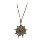 Vintage chain pendant jewelry featuring a decorative star design with a red stone center