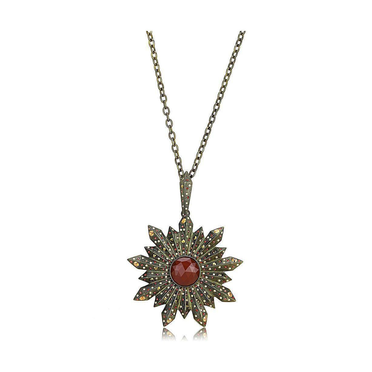 Vintage chain pendant jewelry featuring a decorative star design with a red stone center