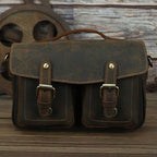 Vintage leather camera bag with dual front pockets and sturdy handle for photography enthusiasts