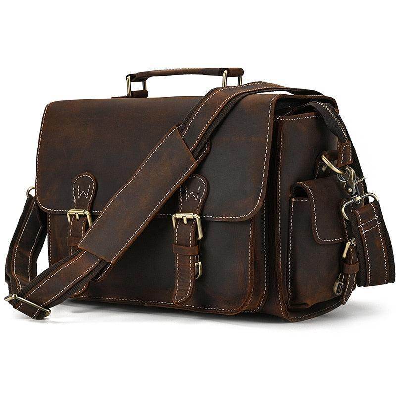 Vintage leather camera bag with adjustable shoulder strap and multiple pockets for storage