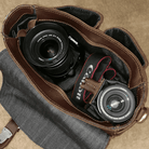 Vintage leather camera bag with dual compartments for secure storage of camera equipment