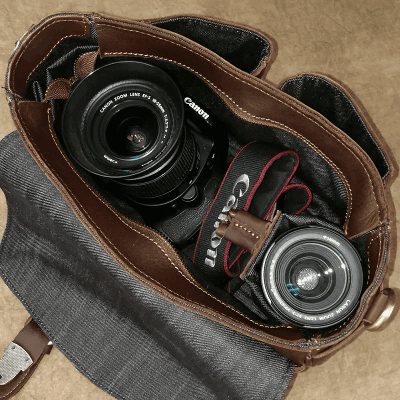 Vintage leather camera bag with dual compartments for secure storage of camera equipment