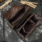 Open vintage leather camera bag showcasing spacious compartments and sturdy design for photographers
