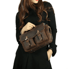 Vintage leather camera bag with adjustable shoulder strap and dual front pockets for photographers