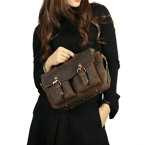 Vintage leather camera bag with adjustable shoulder strap and dual front pockets for photographers