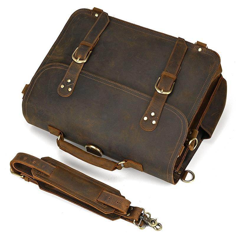 Vintage leather laptop bag with adjustable straps and brass hardware for stylish professionals