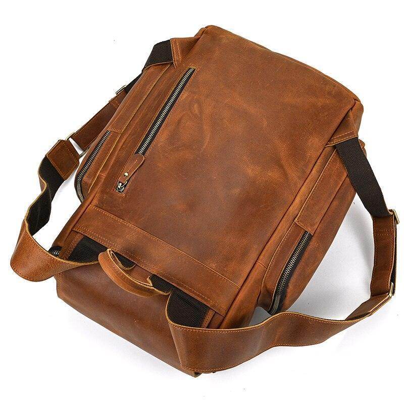 Vintage leather travel backpack in brown with durable straps and multiple compartments