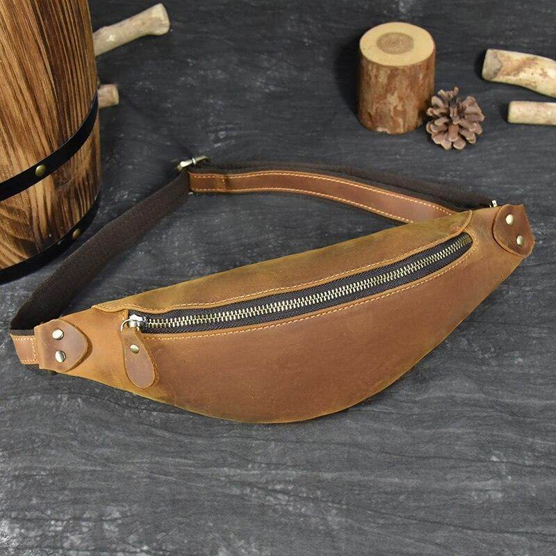 Vintage leather waist bag in brown with a zip closure, perfect for stylish hands-free carrying