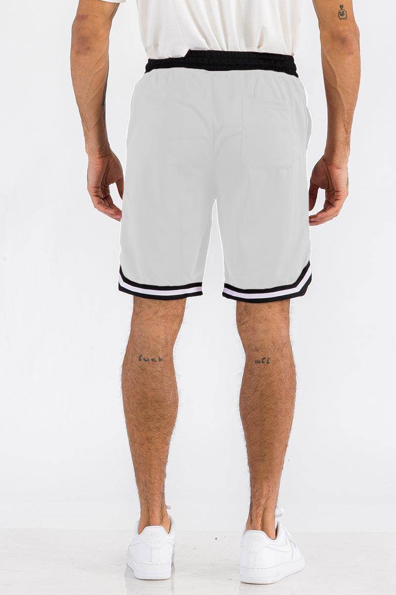 Back view of white athletic shorts for men with black stripes and elastic waistband by VacationGrabs