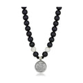 VacationGrabs white metal synthetic beaded necklace with black beads and silver charm pendant