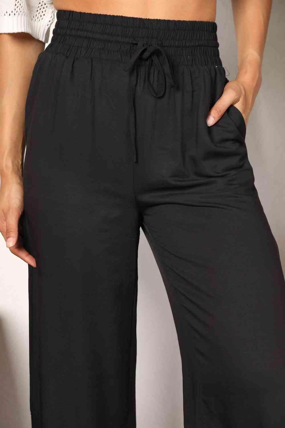 Trendsi black wide leg vacation pants with elastic waistband and side pockets for comfort and style
