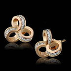 Stunning 925 sterling rhodium earrings featuring intertwined rings and sparkling accents