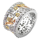 Stunning women's fashion brass ring with intricate silver and gold designs, adorned with sparkling stones.