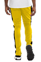 Men's yellow black slim fit track pants from VacationGrabs with a stylish design for active wear